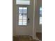 Elegant front door with glass panes offering a glimpse of the neighborhood and secure electronic lock at 126 Westfield Circle, Conway, SC 29526