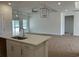 Bright kitchen with modern countertops, pendant lighting and an open floor plan at 126 Westfield Circle, Conway, SC 29526