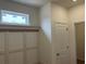 Mudroom features custom storage bench with decorative trim and natural light at 126 Westfield Circle, Conway, SC 29526
