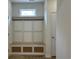 Mudroom features custom storage bench with decorative trim and natural light at 126 Westfield Circle, Conway, SC 29526