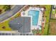 Aerial view of pool with lounge chairs, umbrellas, and shaded areas at 131 Waypoint Ridge Ave. # Q26, Little River, SC 29566