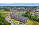 Aerial view of community buildings, manicured lawns, and scenic ponds at 131 Waypoint Ridge Ave. # Q26, Little River, SC 29566
