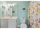 Well-lit bathroom with a vanity, mirror, toilet, and colorful shower curtain at 131 Waypoint Ridge Ave. # Q26, Little River, SC 29566