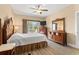 Bright bedroom features natural light, deck access, and furniture with carved wood accents at 131 Waypoint Ridge Ave. # Q26, Little River, SC 29566