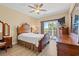 Inviting bedroom with wooden furniture, natural light, and balcony access, creating a comfortable retreat at 131 Waypoint Ridge Ave. # Q26, Little River, SC 29566