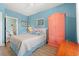 Bright bedroom featuring pastel walls, wood accents, and a view to the ensuite bathroom at 131 Waypoint Ridge Ave. # Q26, Little River, SC 29566