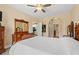 Neutral bedroom featuring a light comforter, wood dresser, and access to the kitchen and bathroom at 131 Waypoint Ridge Ave. # Q26, Little River, SC 29566
