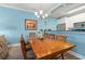 Charming dining room featuring a large wooden table, seating for six, and adjacent breakfast bar area at 131 Waypoint Ridge Ave. # Q26, Little River, SC 29566