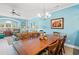 Bright dining area with a large wooden table, comfortable seating, and open-concept living space for entertaining at 131 Waypoint Ridge Ave. # Q26, Little River, SC 29566
