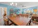 Spacious dining area with natural lighting, a large wooden table, and open access to the living area at 131 Waypoint Ridge Ave. # Q26, Little River, SC 29566
