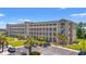 Spacious multi-story condo building with manicured lawns, palm trees, and ample parking at 131 Waypoint Ridge Ave. # Q26, Little River, SC 29566