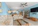 Cozy living room features comfortable sofas, stylish decor, and seamless access to the adjacent kitchen area at 131 Waypoint Ridge Ave. # Q26, Little River, SC 29566