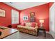 Cozy living room features vibrant red walls and a comfortable floral sofa at 131 Waypoint Ridge Ave. # Q26, Little River, SC 29566