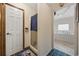 Bright bathroom featuring a shower, tiled floors, and a glimpse into the relaxing tub area at 1342 Highway 90, Conway, SC 29526