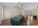 Open dining room with vaulted ceilings, ceiling fan and access to the back yard at 1342 Highway 90, Conway, SC 29526