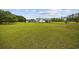 Charming home boasts a large lawn with mature trees and foliage at 1342 Highway 90, Conway, SC 29526
