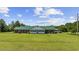 Lovely single story home with a large front yard and green metal roof at 1342 Highway 90, Conway, SC 29526