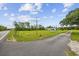 Spacious property with a long driveway, mature trees and green space at 1342 Highway 90, Conway, SC 29526