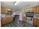 Galley kitchen boasts stainless steel appliances and a view into the living room at 1342 Highway 90, Conway, SC 29526