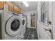 Neat laundry room with modern appliances and tiled floors at 1342 Highway 90, Conway, SC 29526
