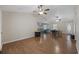 Open-concept living room boasts hardwood floors, ceiling fans, and natural light at 1342 Highway 90, Conway, SC 29526
