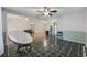 View of the living room and dining room with nice tile floors and ceiling fans at 1342 Highway 90, Conway, SC 29526
