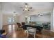 Spacious living room with hardwood floors, ceiling fans, and access to the kitchen and outdoor space at 1342 Highway 90, Conway, SC 29526