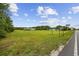 Expansive green lawn surrounds the property with mature trees at 1342 Highway 90, Conway, SC 29526