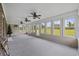 Enclosed sunroom features multiple windows and ceiling fans, perfect for relaxing at 1342 Highway 90, Conway, SC 29526