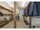 Spacious walk-in closet with wooden shelving and hanging racks for ample storage at 1342 Highway 90, Conway, SC 29526