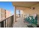 Condo balcony features chairs and an ocean view between buildings at 1425 S Ocean Blvd. # 2A, North Myrtle Beach, SC 29582