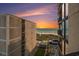 Balcony view of beach at sunset between two buildings at 1425 S Ocean Blvd. # 2A, North Myrtle Beach, SC 29582