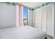 Bedroom with large closet and sliding glass door to balcony with a view at 1425 S Ocean Blvd. # 2A, North Myrtle Beach, SC 29582