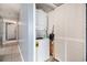 A laundry closet area with a stacked washer/dryer unit and storage at 1425 S Ocean Blvd. # 2A, North Myrtle Beach, SC 29582