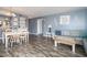 Open concept living space featuring a dining area with a built-in wet bar with light blue walls at 1425 S Ocean Blvd. # 2A, North Myrtle Beach, SC 29582
