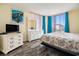 A serene main bedroom featuring ample natural light and beach-themed decor at 1425 S Ocean Blvd. # 2A, North Myrtle Beach, SC 29582