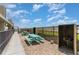 Community picnic area featuring picnic tables and charcoal grills on a bed of gravel, perfect for outdoor dining at 1425 S Ocean Blvd. # 2A, North Myrtle Beach, SC 29582