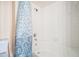 A shower and tub combination featuring a patterned shower curtain at 1425 S Ocean Blvd. # 2A, North Myrtle Beach, SC 29582