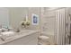 Bright bathroom featuring a vanity with generous countertop space and shower/tub combo at 144 Warner Crossing Way, Loris, SC 29569