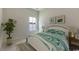 Bright bedroom with a large window, white furniture, and decorative wall art, creating a calming and inviting space at 144 Warner Crossing Way, Loris, SC 29569