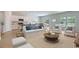 Bright and airy living room with large windows and open concept dining and kitchen at 144 Warner Crossing Way, Loris, SC 29569