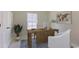 Comfortable home office featuring a large desk, neutral decor, and a large window at 144 Warner Crossing Way, Loris, SC 29569