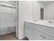 Bright bathroom features a double sink vanity, wood-look tile flooring and shower with curtain at 1560 Swing Bridge Way, Myrtle Beach, SC 29588