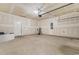 Spacious unfinished garage with painted walls, concrete flooring, and an automatic door opener at 1560 Swing Bridge Way, Myrtle Beach, SC 29588