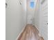 Bright hallway features soaring ceilings, wood-look floors, and a large window for natural light at 1560 Swing Bridge Way, Myrtle Beach, SC 29588