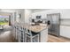Modern kitchen with granite countertops, stainless steel appliances, and a breakfast bar at 1560 Swing Bridge Way, Myrtle Beach, SC 29588