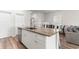 Spacious kitchen island provides ample counter space and seating, ideal for casual dining and entertaining at 1560 Swing Bridge Way, Myrtle Beach, SC 29588