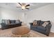Living room features two couches, a ceiling fan, and a decorative area rug at 1560 Swing Bridge Way, Myrtle Beach, SC 29588