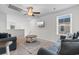 Living room features a ceiling fan, window with blinds and a comfortable seating area at 1560 Swing Bridge Way, Myrtle Beach, SC 29588