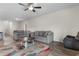 Cozy living room with grey sofas, an area rug, and hardwood floors at 1560 Swing Bridge Way, Myrtle Beach, SC 29588